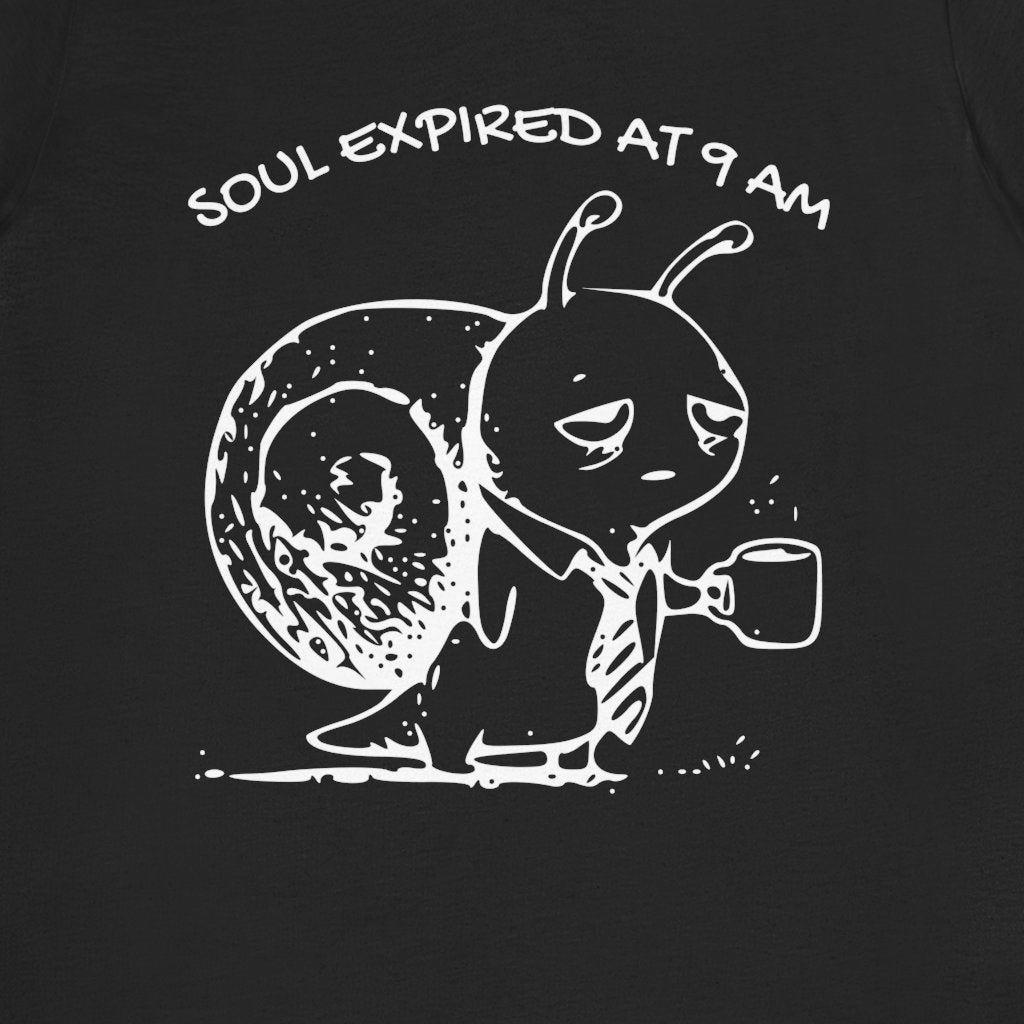 Close view of the Soul Expired at 9 AM slogan and Snail holding a coffee mug on the black T-shirt.