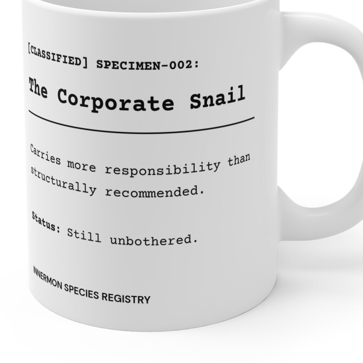Close-up of the printed Species File and registry footer on the Corporate Snail mug; partial mug view showing the actual curved print.