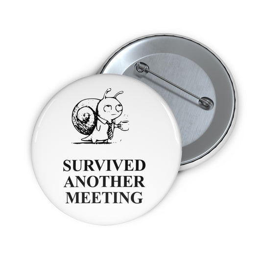Corporate Snail award badge, front and reverse views of one 2.25-inch badge